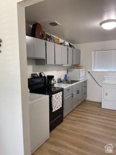 856 N 600 E, Lehi, UT 84043 - kitchen with black / electric stove, white microwave, gray cabinetry, and light wood finished floors