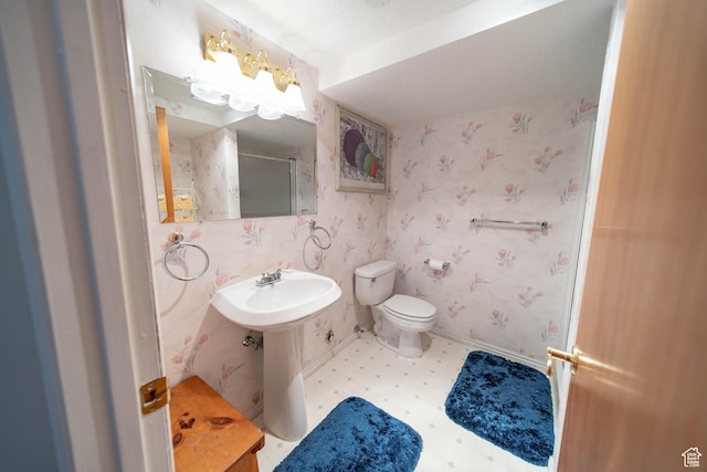 1416 W Valley View Dr, Wellington, UT 84542 - bathroom featuring wallpapered walls, tile patterned floors, and a shower