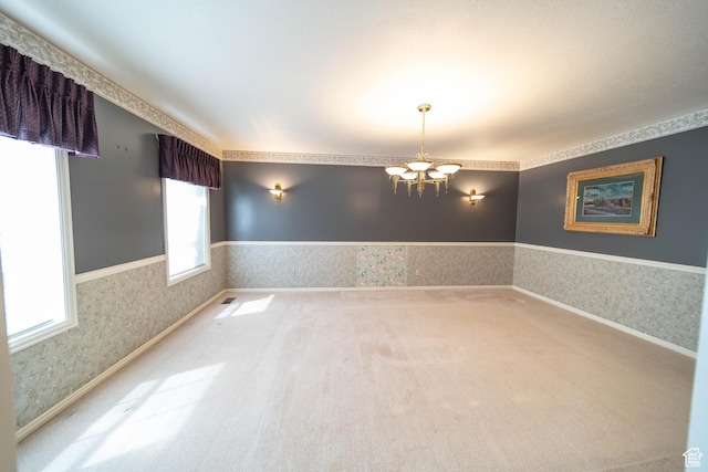 1416 W Valley View Dr, Wellington, UT 84542 - empty room featuring wallpapered walls, a chandelier, and carpet flooring