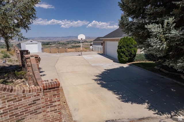 1416 W Valley View Dr, Wellington, UT 84542 - view of yard with a garage and concrete driveway