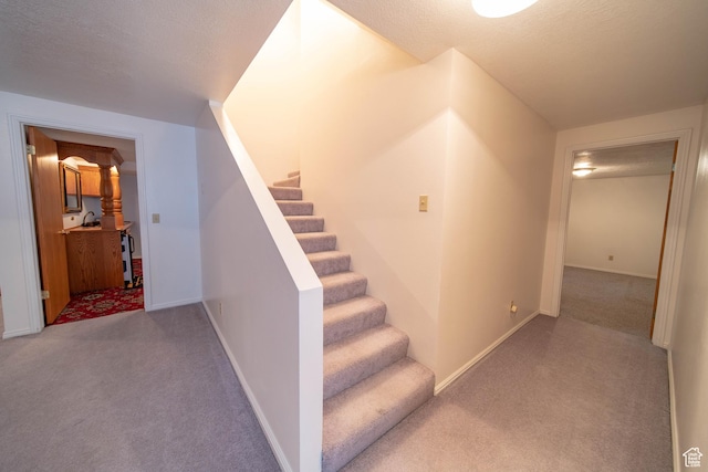 1416 W Valley View Dr, Wellington, UT 84542 - stairs featuring carpet and baseboards