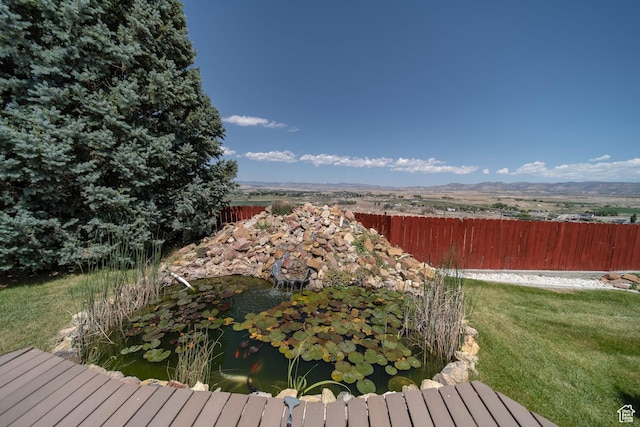 1416 W Valley View Dr, Wellington, UT 84542 - wooden terrace featuring a small pond