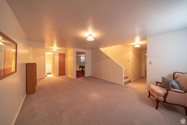 1416 W Valley View Dr, Wellington, UT 84542 - unfurnished living room featuring stairs, light carpet, and a textured ceiling
