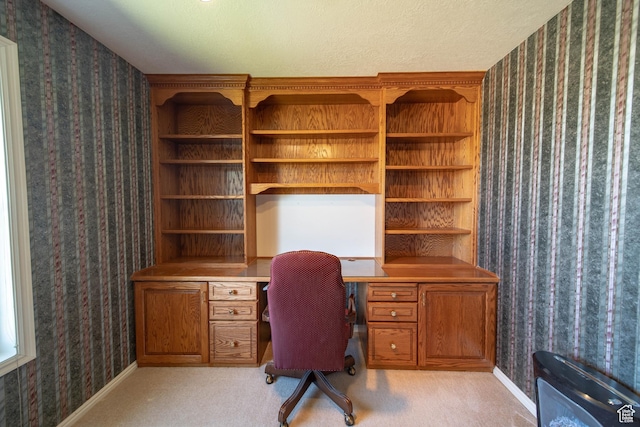 1416 W Valley View Dr, Wellington, UT 84542 - home office with wallpapered walls, built in desk, and light carpet