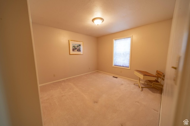 1416 W Valley View Dr, Wellington, UT 84542 - carpeted spare room featuring baseboards and a textured ceiling