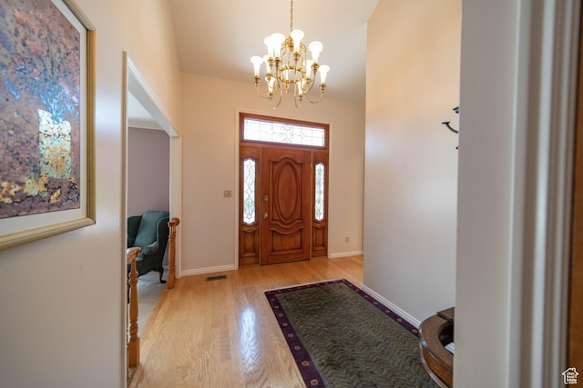 1416 W Valley View Dr, Wellington, UT 84542 - foyer entrance featuring a chandelier and light wood finished floors