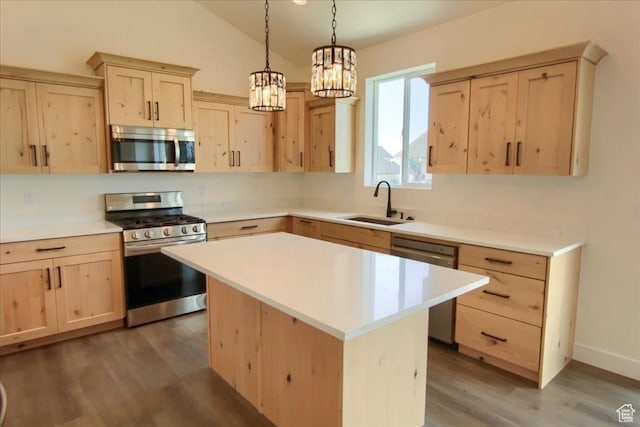 4181 W 1725 S, West Haven, UT 84401 - kitchen featuring appliances with stainless steel finishes, light brown cabinetry, wood finished floors, light countertops, and a chandelier