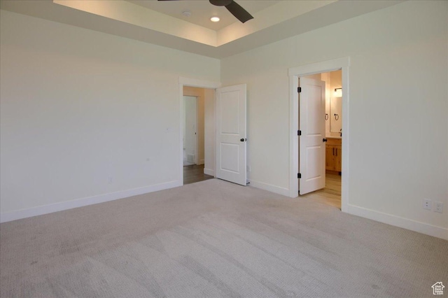 4181 W 1725 S, West Haven, UT 84401 - unfurnished bedroom with light colored carpet, connected bathroom, a tray ceiling, and recessed lighting