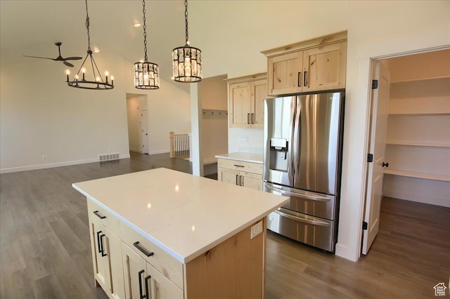 4181 W 1725 S, West Haven, UT 84401 - kitchen with stainless steel fridge, a chandelier, dark wood finished floors, and light countertops