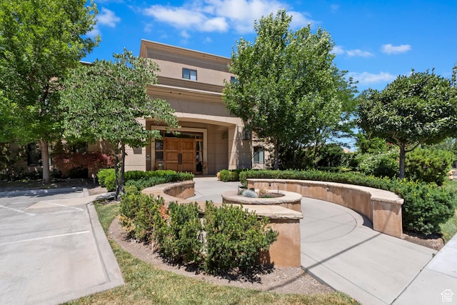 1706 E Murray Holladay Rd S Unit 204, Holladay, UT 84117 - view of front of house featuring stucco siding