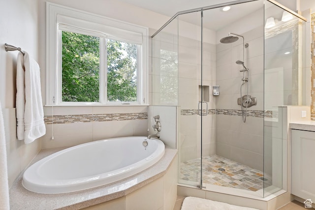 1706 E Murray Holladay Rd S Unit 204, Holladay, UT 84117 - full bathroom with a garden tub, a stall shower, and vanity