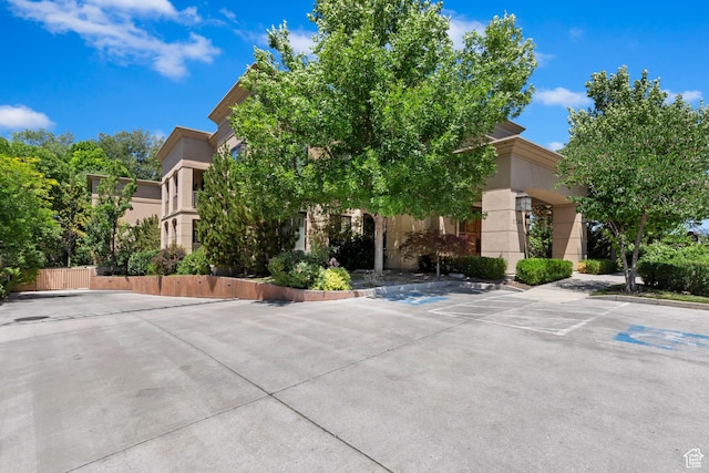 1706 E Murray Holladay Rd S Unit 204, Holladay, UT 84117 - view of building exterior with uncovered parking