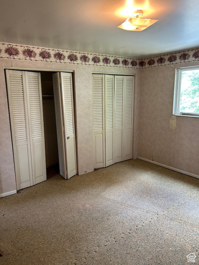 2784 W 2890 S, West Valley City, UT 84119 - unfurnished bedroom featuring two closets and light carpet