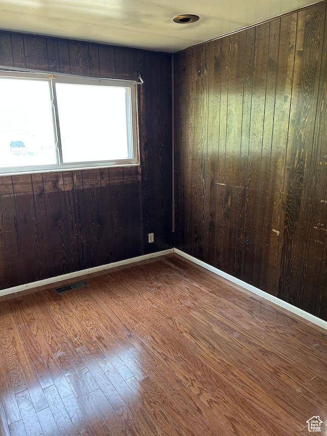 2784 W 2890 S, West Valley City, UT 84119 - spare room featuring wood finished floors and wood walls