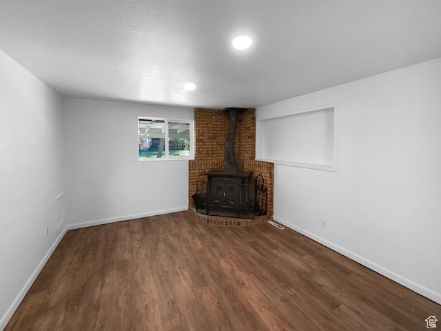 270 N 500 E, Spanish Fork, UT 84660 - unfurnished living room with a wood stove, wood finished floors, and recessed lighting