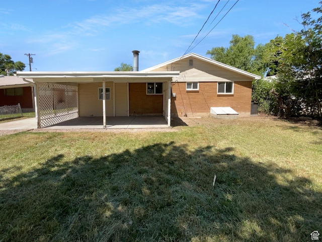 270 N 500 E, Spanish Fork, UT 84660 - rear view of property with a yard, an attached carport, and brick siding