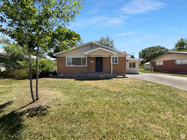 270 N 500 E, Spanish Fork, UT 84660 - view of front facade featuring brick siding, concrete driveway, and a front lawn