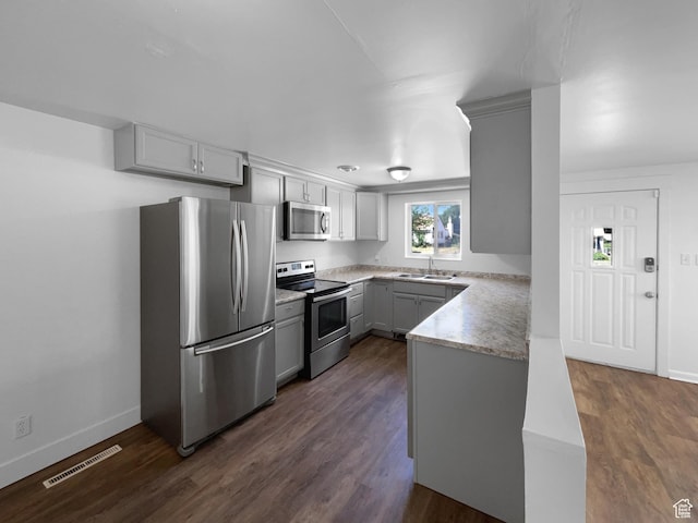 270 N 500 E, Spanish Fork, UT 84660 - kitchen with stainless steel appliances, gray cabinetry, light countertops, and dark wood-style flooring