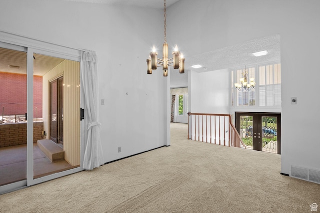 771 E 17th Ave, Salt Lake City, UT 84103 - spare room with a chandelier, carpet, and a high ceiling