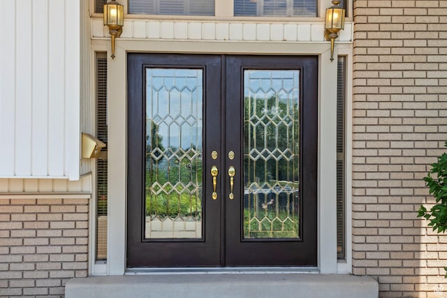 771 E 17th Ave, Salt Lake City, UT 84103 - property entrance featuring french doors, brick siding, and board and batten siding
