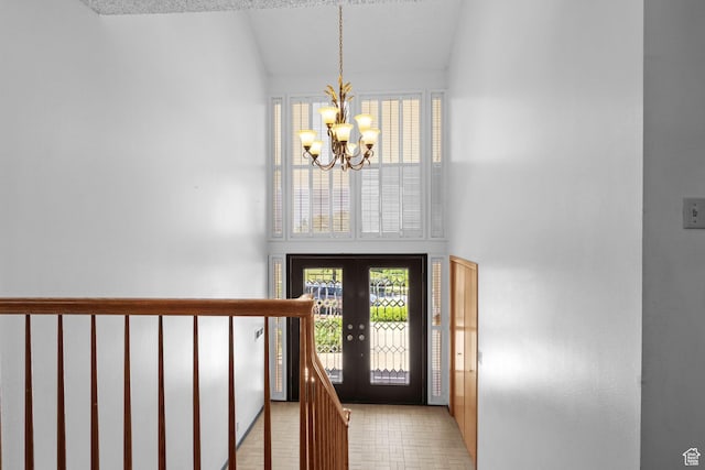 771 E 17th Ave, Salt Lake City, UT 84103 - foyer entrance with a chandelier, french doors, plenty of natural light, and lofted ceiling