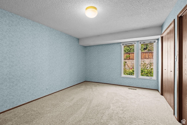 771 E 17th Ave, Salt Lake City, UT 84103 - unfurnished bedroom featuring a textured ceiling, carpet, and a closet