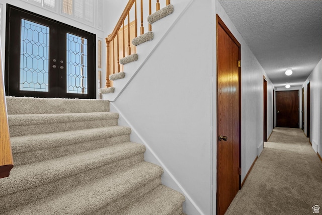 771 E 17th Ave, Salt Lake City, UT 84103 - stairs with a textured ceiling, carpet flooring, and french doors