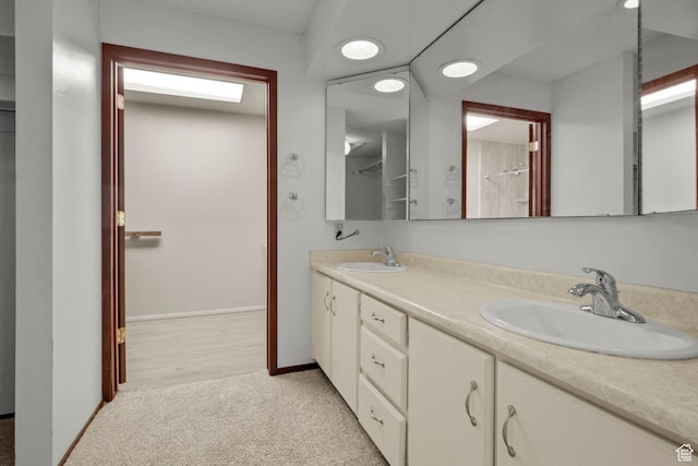 771 E 17th Ave, Salt Lake City, UT 84103 - bathroom featuring double vanity and baseboards