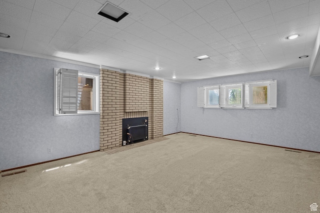 771 E 17th Ave, Salt Lake City, UT 84103 - unfurnished living room with carpet flooring, a wood stove, and recessed lighting