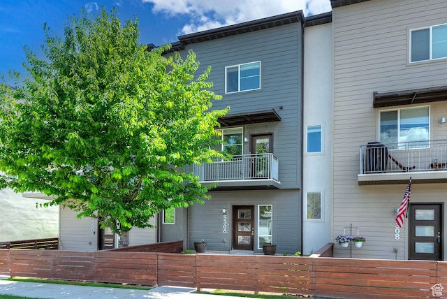 5306 W Solafax Ln, Herriman, UT 84096 - view of front facade featuring a fenced front yard and a balcony