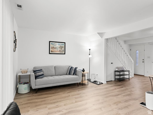 5423 S Tonalea Dr, Murray, UT 84107 - living room featuring stairway and light wood-style floors