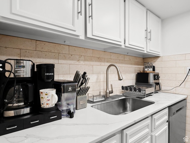 5423 S Tonalea Dr, Murray, UT 84107 - kitchen featuring stainless steel dishwasher, white cabinets, tasteful backsplash, and light stone countertops