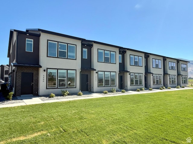 3400 S 1010 W, Nibley, UT 84321 - contemporary house featuring stucco siding and a front yard