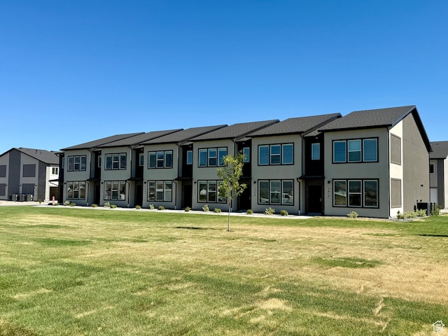 3400 S 1010 W, Nibley, UT 84321 - view of front of house featuring a front lawn, a residential view, and stucco siding