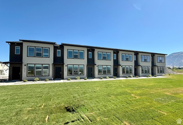 3400 S 1010 W, Nibley, UT 84321 - contemporary home with stucco siding and a front yard