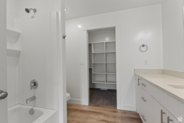 3400 S 1010 W, Nibley, UT 84321 - full bathroom featuring wood finished floors, vanity, bathing tub / shower combination, and a spacious closet