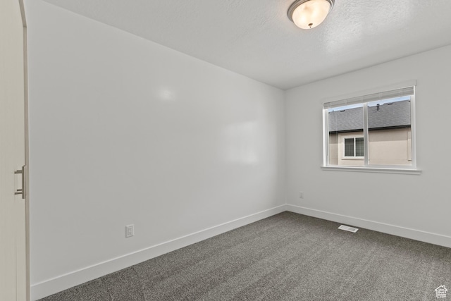 3400 S 1010 W, Nibley, UT 84321 - spare room with dark colored carpet and a textured ceiling