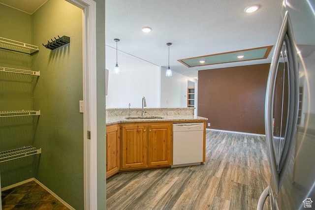 305 S Sheridan St, Stockton, UT 84071 - kitchen featuring freestanding refrigerator, dishwasher, light stone countertops, hanging light fixtures, and wood finished floors