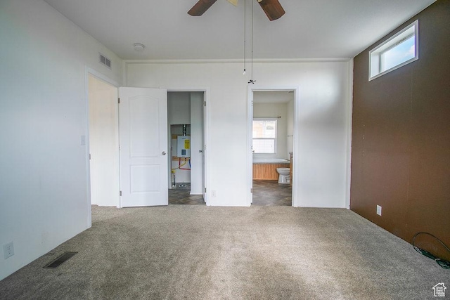 305 S Sheridan St, Stockton, UT 84071 - unfurnished bedroom featuring carpet, connected bathroom, and a ceiling fan