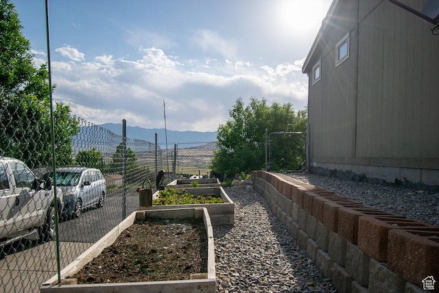 305 S Sheridan St, Stockton, UT 84071 - view of yard featuring a mountain view and a garden