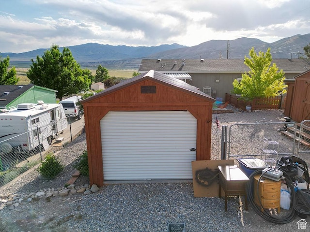 305 S Sheridan St, Stockton, UT 84071 - detached garage featuring a mountain view and gravel driveway