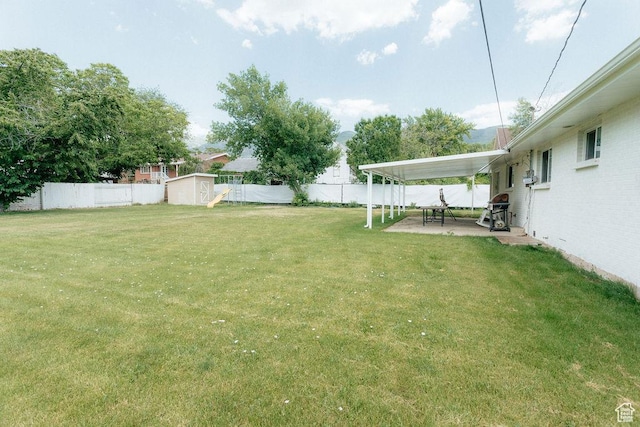571 E Center St, Kaysville, UT 84037 - fenced backyard featuring a shed and a patio