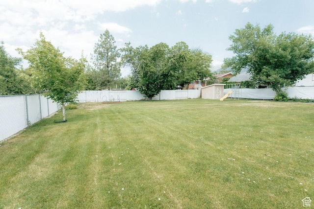 571 E Center St, Kaysville, UT 84037 - fenced backyard featuring a storage shed