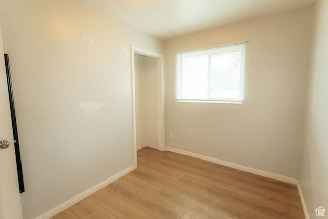 571 E Center St, Kaysville, UT 84037 - empty room with light wood-style flooring and baseboards