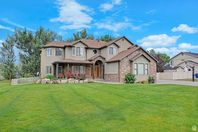 297 N Frontier Rd, Farmington, UT 84025 - view of front of house with stucco siding, stone siding, and driveway