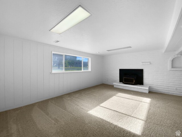 1175 N 1100 W, West Bountiful, UT 84087 - unfurnished living room featuring carpet floors and a wood stove