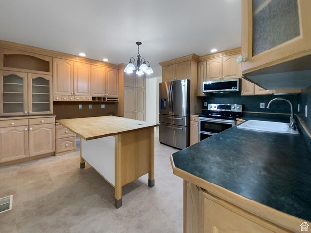 1175 N 1100 W, West Bountiful, UT 84087 - kitchen with stainless steel appliances, light brown cabinetry, a chandelier, recessed lighting, and glass insert cabinets