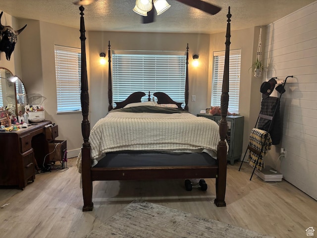 2673 S 2400 W, Weston, ID 83286 - bedroom featuring wood finished floors, a textured ceiling, and ceiling fan