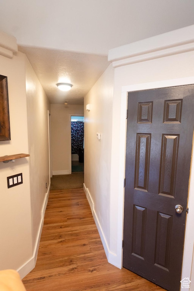 2673 S 2400 W, Weston, ID 83286 - hall featuring wood finished floors and baseboards