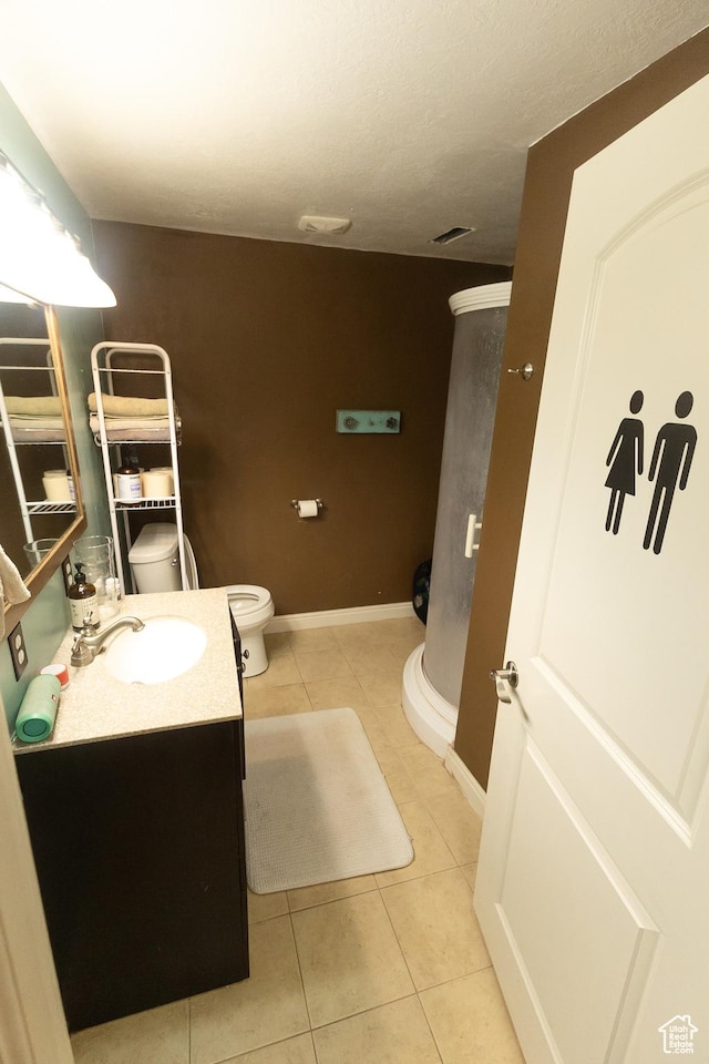 2673 S 2400 W, Weston, ID 83286 - bathroom featuring tile patterned flooring, vanity, and a stall shower